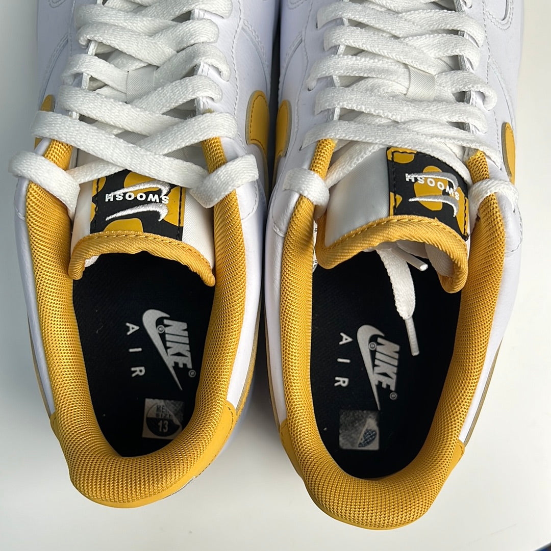 White and yellow shop air force ones